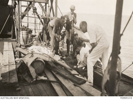 Empire Star - inspecting bomb damage - 35kB jpg